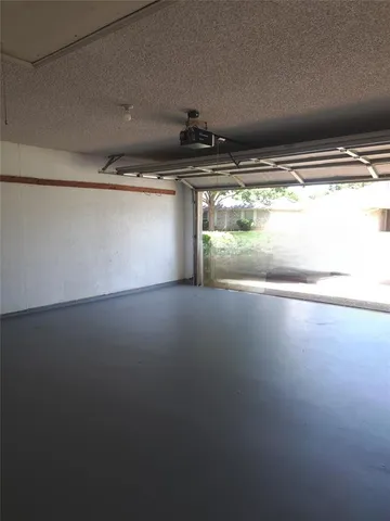 a view of room with window and ceiling fan