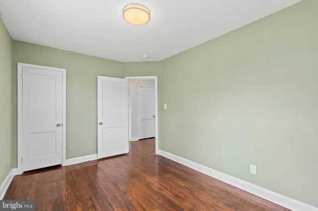 an empty room with wooden floor