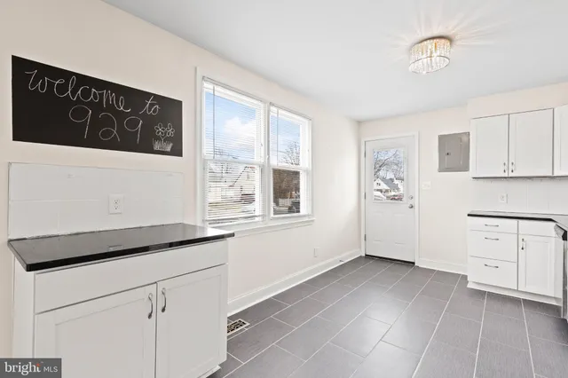 a kitchen with a cabinets and a stove top oven