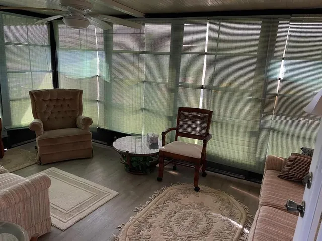 a living room with furniture and a window