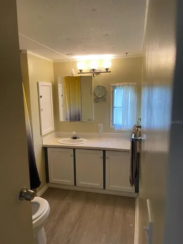 a bathroom with a sink and mirror