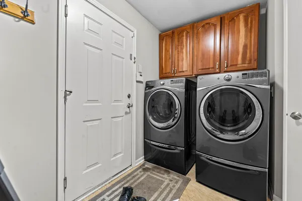 a utility room with dryer and washer