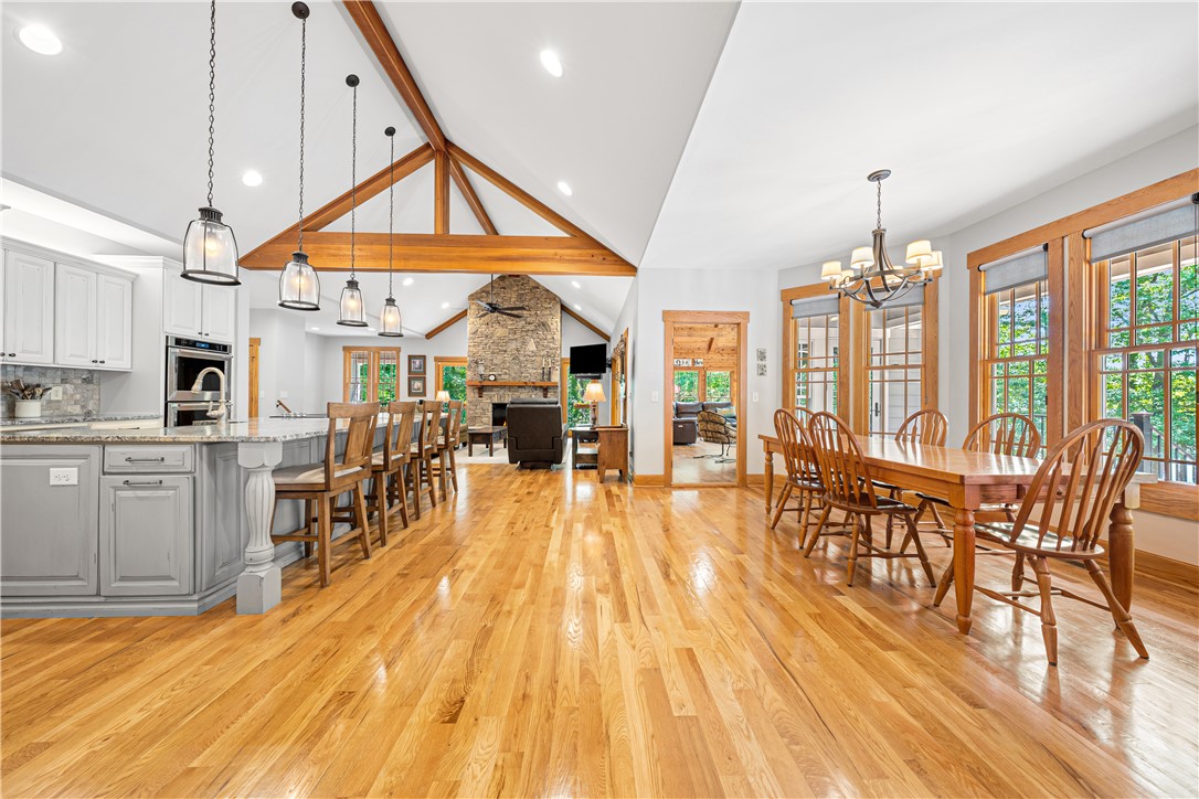 285 Bertha Allen Road Westminster, SC 29693 - Photo 14 of 50 An inviting open concept living area boasts vaulted ceilings and lustrous hardwood flooring.