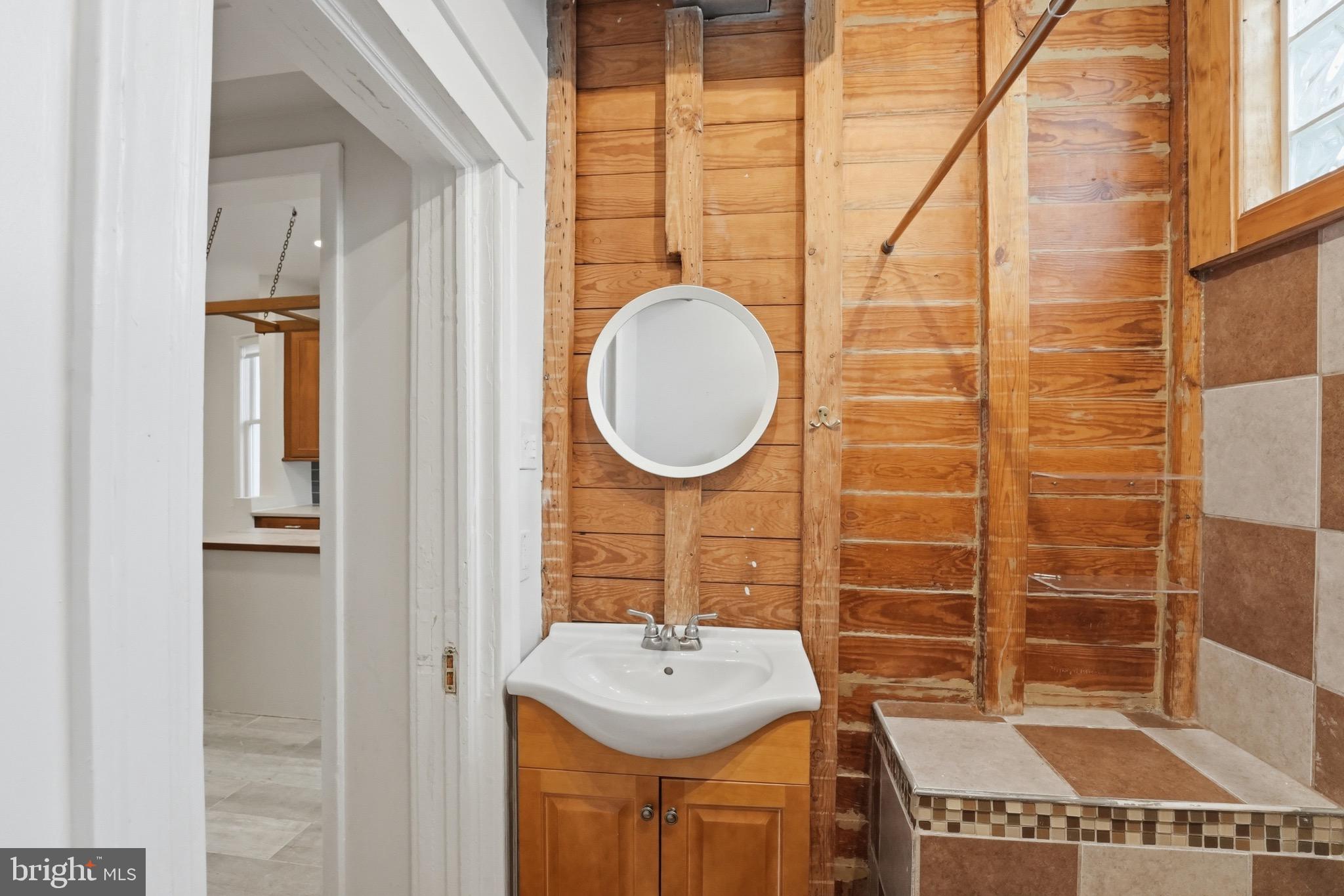 1310 Emerson Street Northwest Washington, DC 20011 - Photo 12 of 38 a bathroom with a sink and a mirror