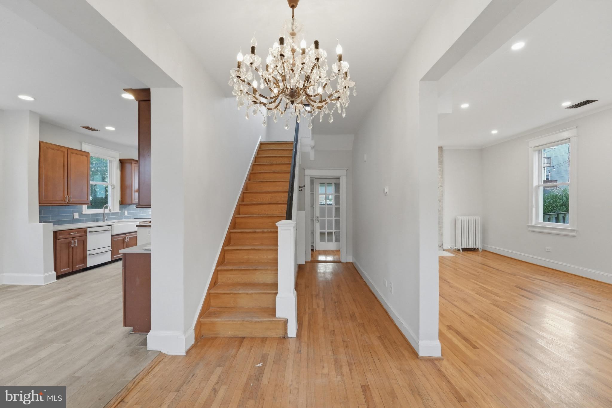 1310 Emerson Street Northwest Washington, DC 20011 - Photo 2 of 38 a view of a hallway with wooden floor and staircase