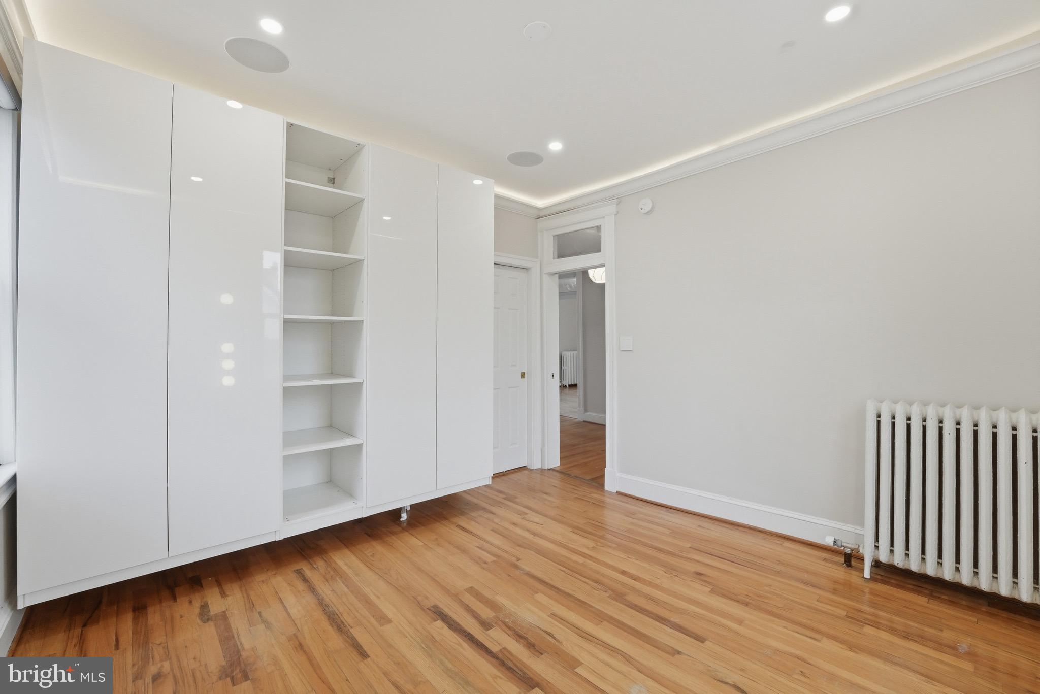 1310 Emerson Street Northwest Washington, DC 20011 - Photo 22 of 38 a view of empty room with wooden floor and entryway