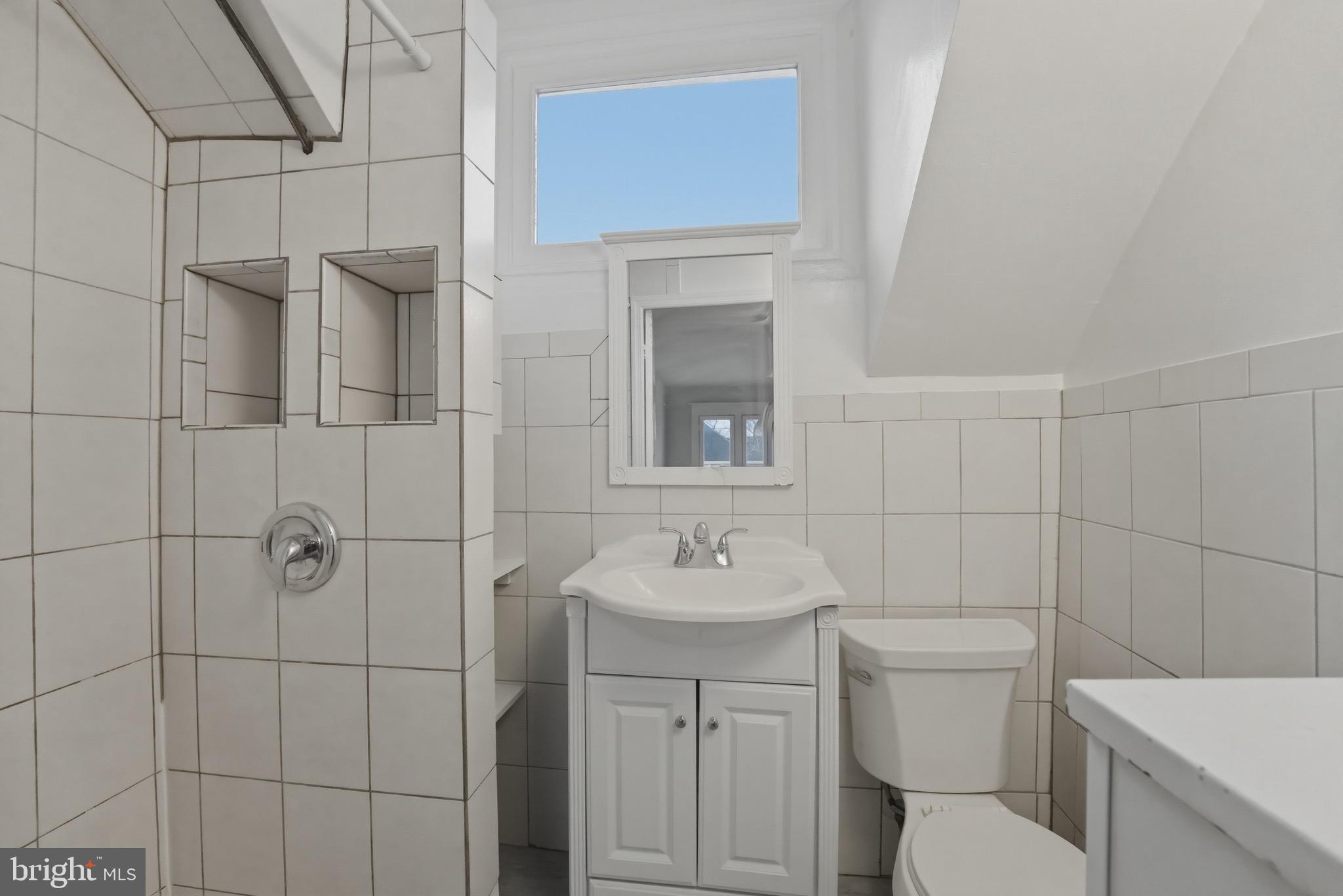 1310 Emerson Street Northwest Washington, DC 20011 - Photo 29 of 38 a bathroom with a toilet sink and shower