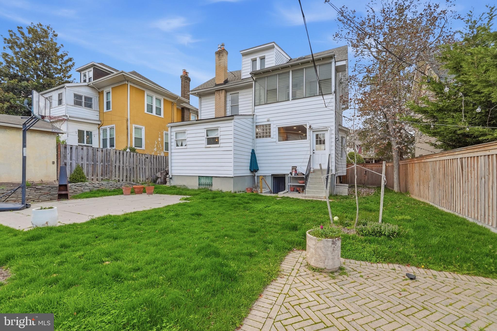 1310 Emerson Street Northwest Washington, DC 20011 - Photo 37 of 38 a front view of a house with a yard