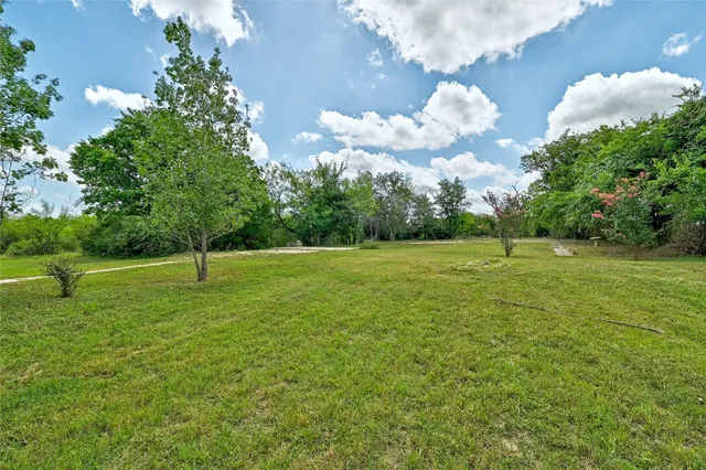 a view of a golf course with a lake