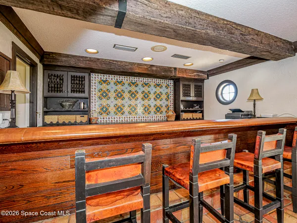 a view of a hallway with seating space and furniture