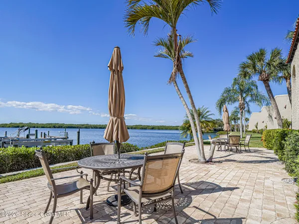 a view of a dinning table and chairs in patio
