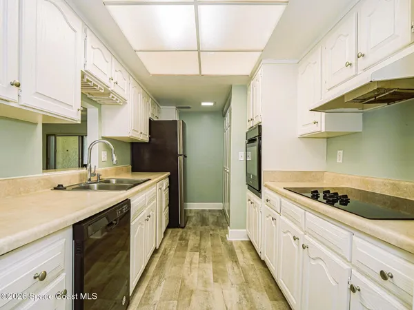 a kitchen with a stove and a sink
