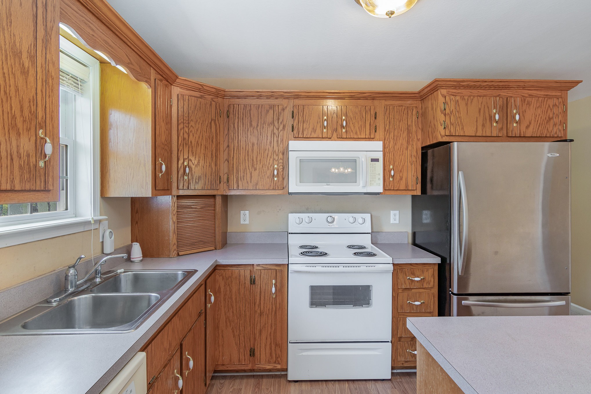 2575 Whitfield Road Clarksville, TN 37040 - Photo 12 of 30 a kitchen that has a sink cabinets counter space and appliances
