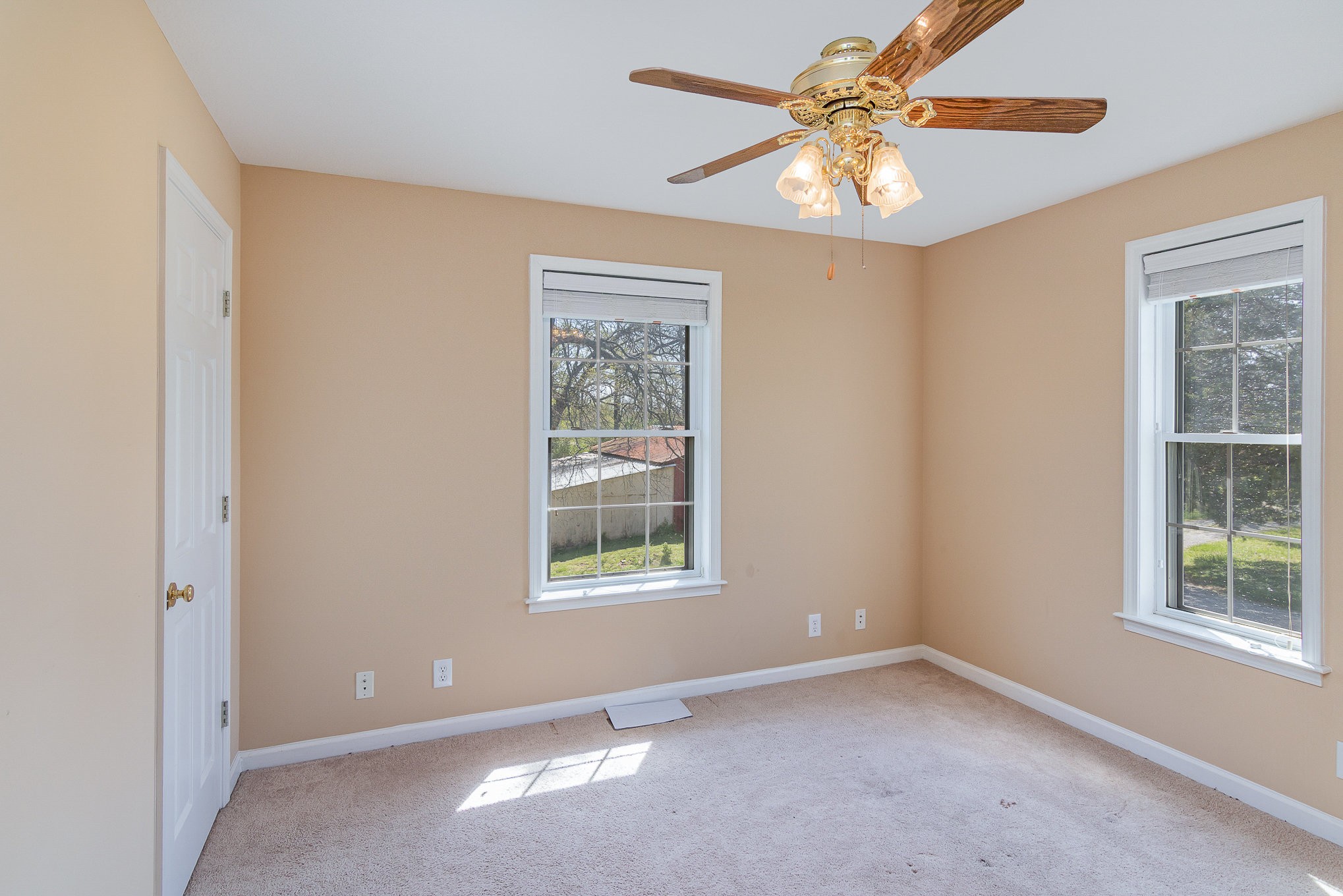 2575 Whitfield Road Clarksville, TN 37040 - Photo 18 of 30 an empty room with windows and chandelier fan