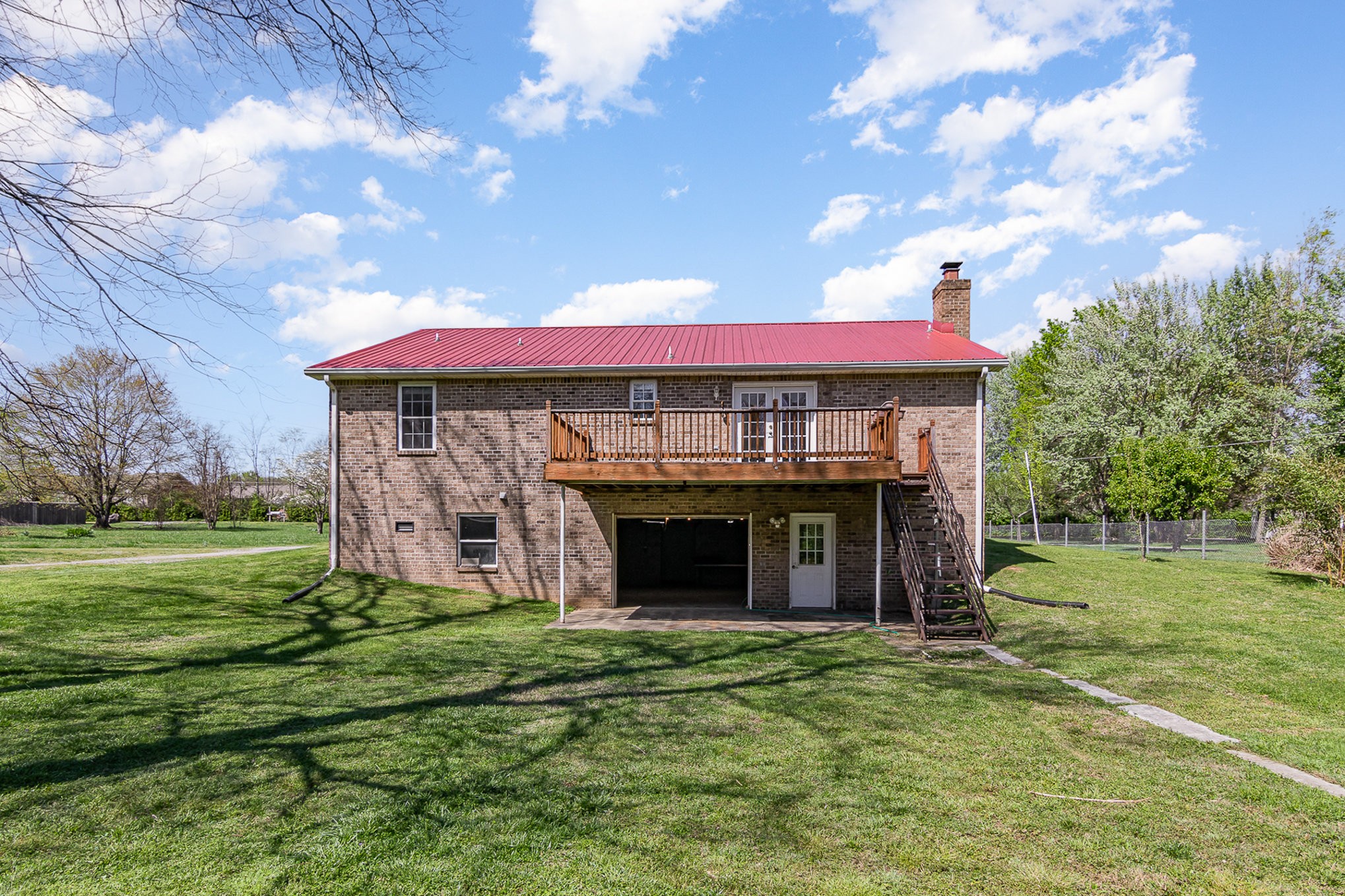 2575 Whitfield Road Clarksville, TN 37040 - Photo 26 of 30 a front view of a house with a garden