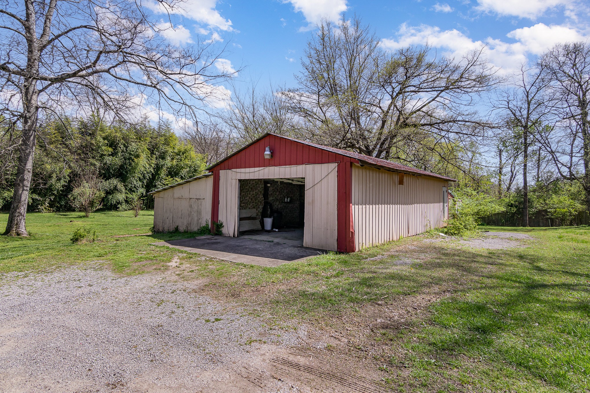 2575 Whitfield Road Clarksville, TN 37040 - Photo 29 of 30 a yellow house with a big yard plants and big trees