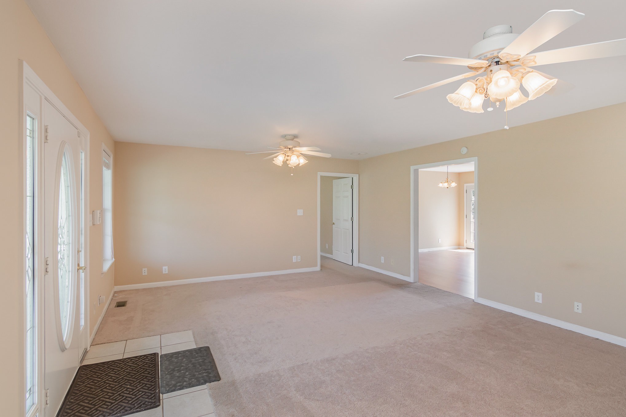 2575 Whitfield Road Clarksville, TN 37040 - Photo 5 of 30 an empty room with chandelier fan and window