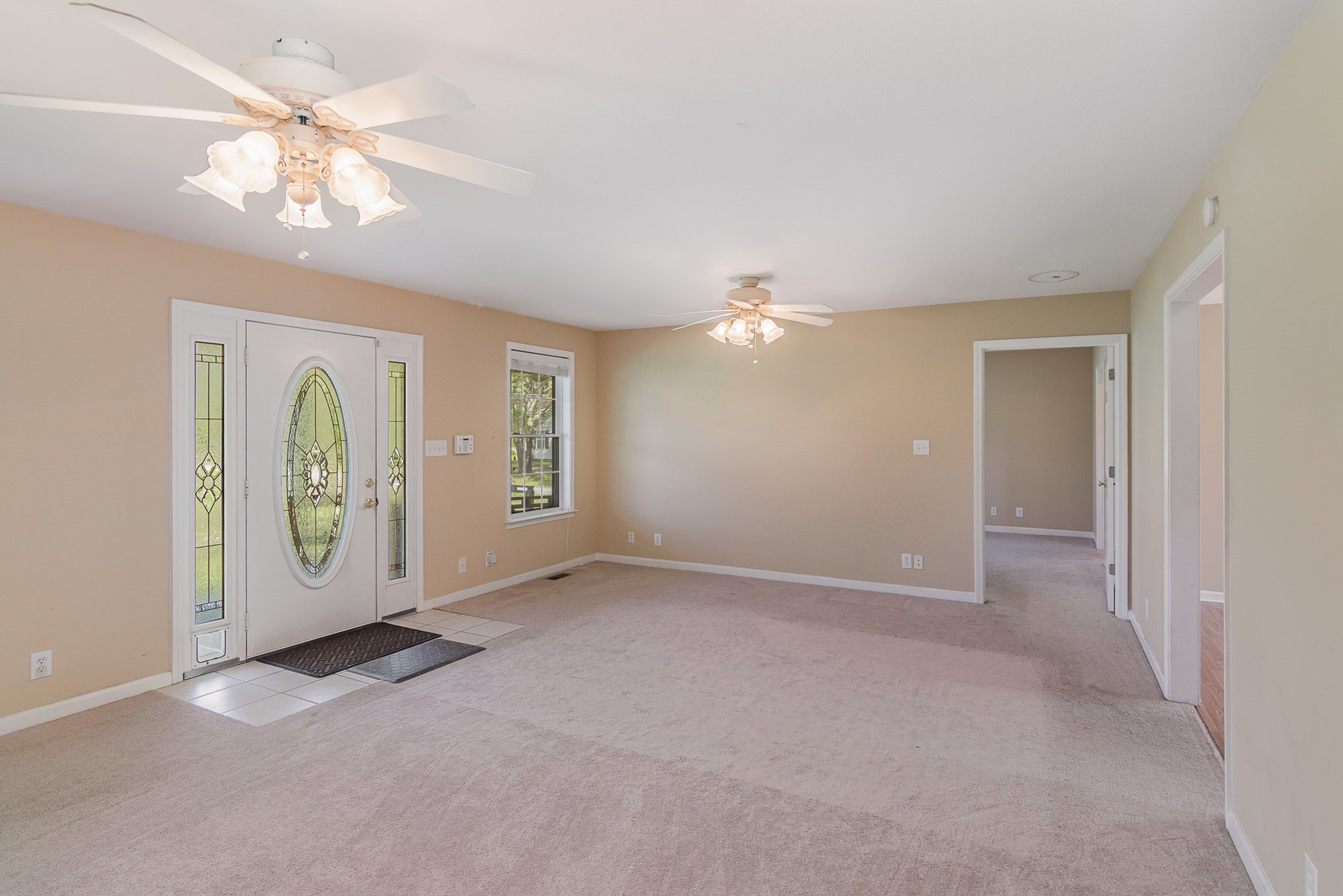 2575 Whitfield Road Clarksville, TN 37040 - Photo 6 of 30 an empty room with chandelier fan and windows
