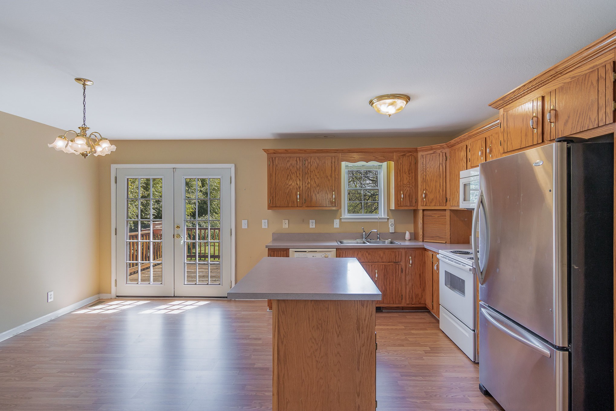 2575 Whitfield Road Clarksville, TN 37040 - Photo 10 of 30 a kitchen with stainless steel appliances a refrigerator sink and cabinets