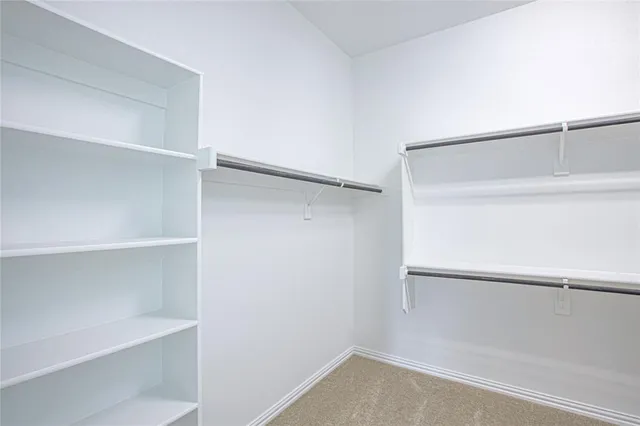 a view of an empty walk in closet