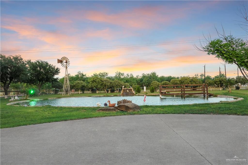 5051 Iowa Road Penitas, TX 78576 - Photo 6 of 10 View of community featuring a lawn