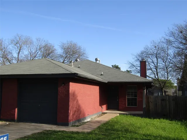 a front view of house with yard and entertaining space