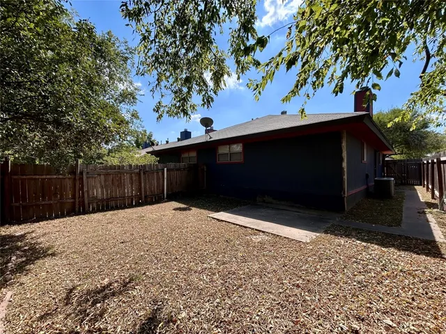 a backyard of a house with seating space