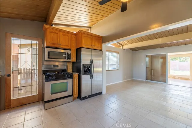 a view of a kitchen with refrigerator kitchen and windows