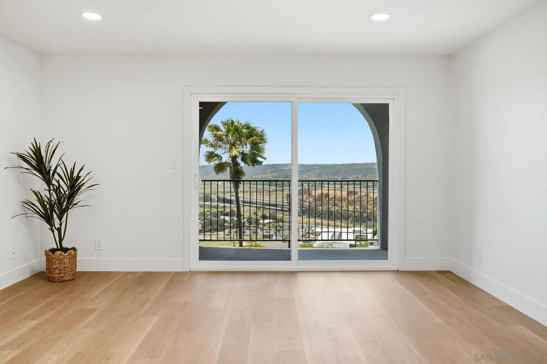 3606 Vista Rey, Unit 46 Oceanside, CA 92057 - Photo 10 of 36 a view of an empty room with a window and potted plant