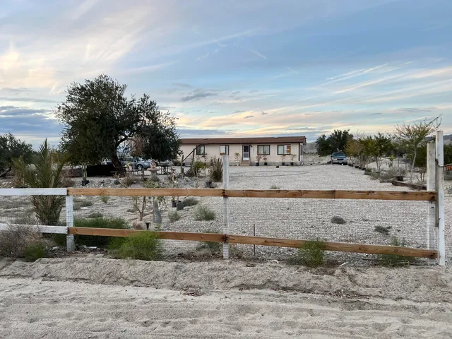 a view of a yard with an outdoor space