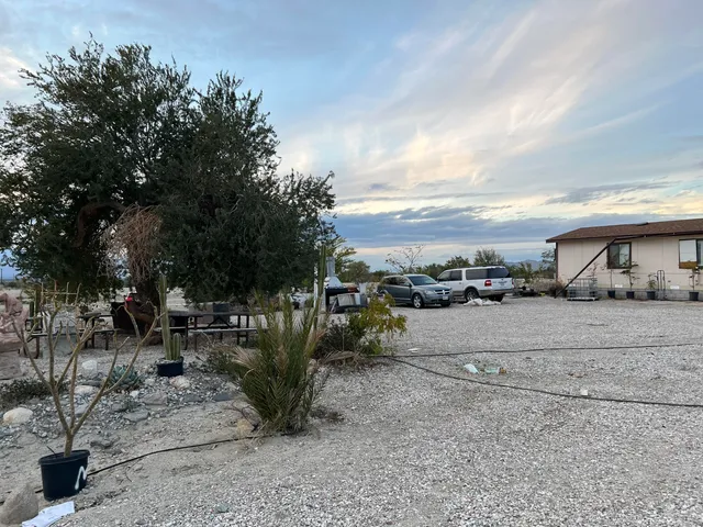 a view of a street with couple of cars parked