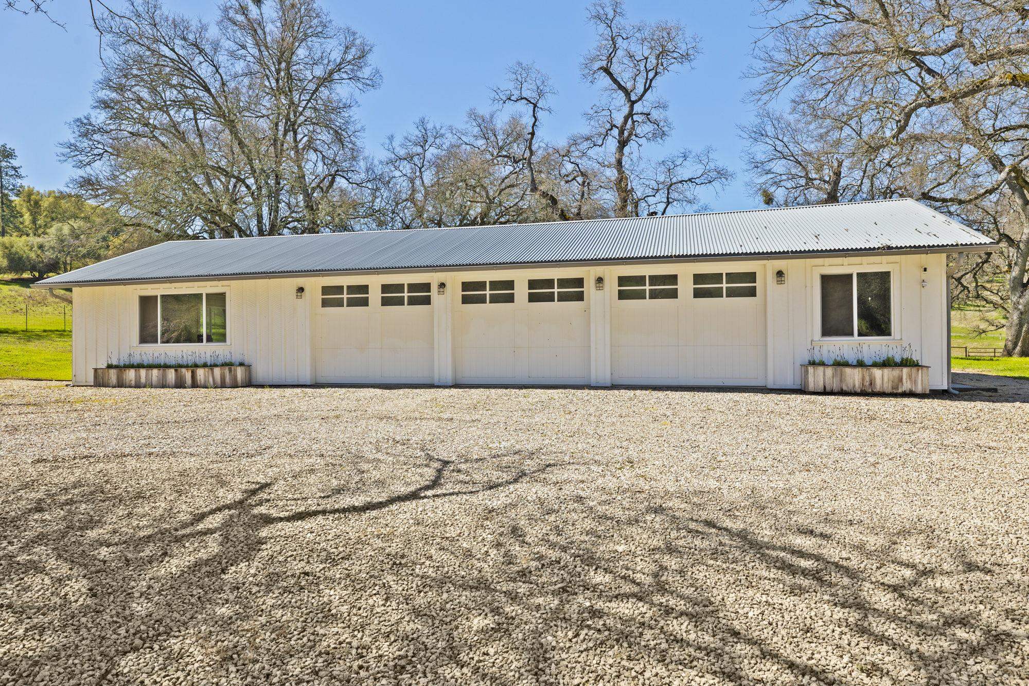 514 Appaloosa Road Angels Camp, CA 95222 - Photo 37 of 57 3 Car Finished Garage with Large Bonus Room on the Left and Large Utility Room on the Right