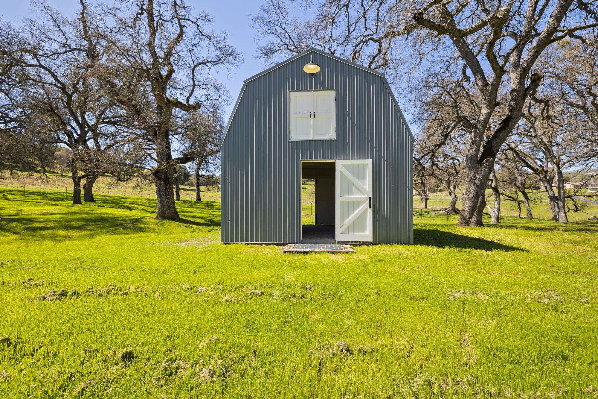 514 Appaloosa Road Angels Camp, CA 95222 - Photo 48 of 57 Small Barn with Beautiful Open Beamed Ceiling Details and Whitewashed Wood Walls and Wall Sconces