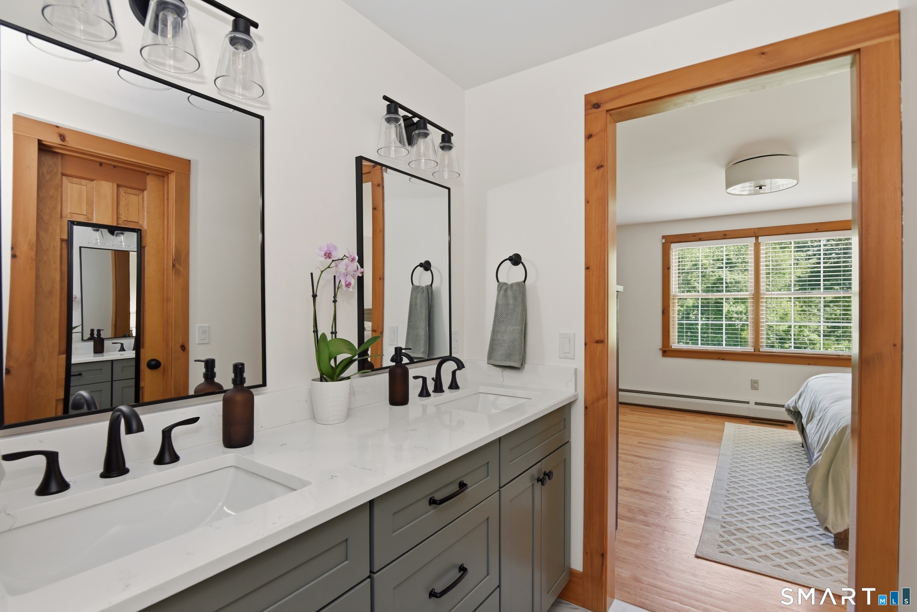 80 West Quasset Road Woodstock, CT 06281 - Photo 10 of 38 Primary bathroom, remodeled 2026, features double sinks and walk-in closet.