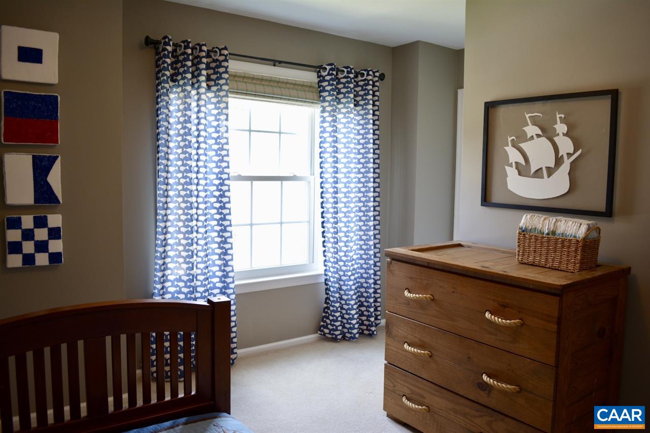 1167 Raintree Drive Charlottesville, VA 22901 - Photo 19 of 24 a bedroom with a bed and a window