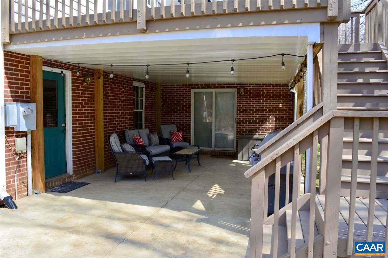 1167 Raintree Drive Charlottesville, VA 22901 - Photo 3 of 24 a view of a patio with table and chairs
