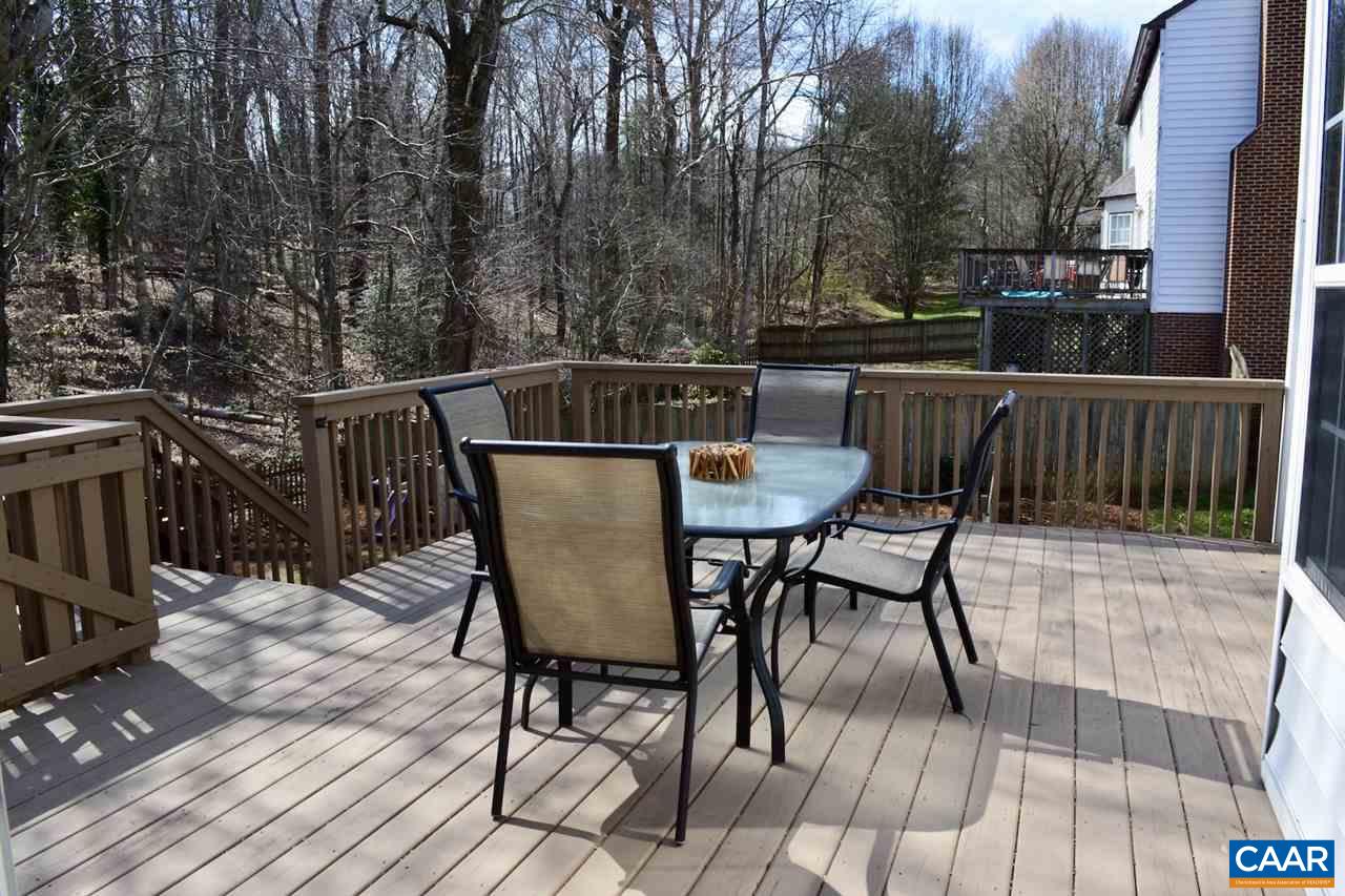 1167 Raintree Drive Charlottesville, VA 22901 - Photo 4 of 24 a view of a chairs and table on the deck