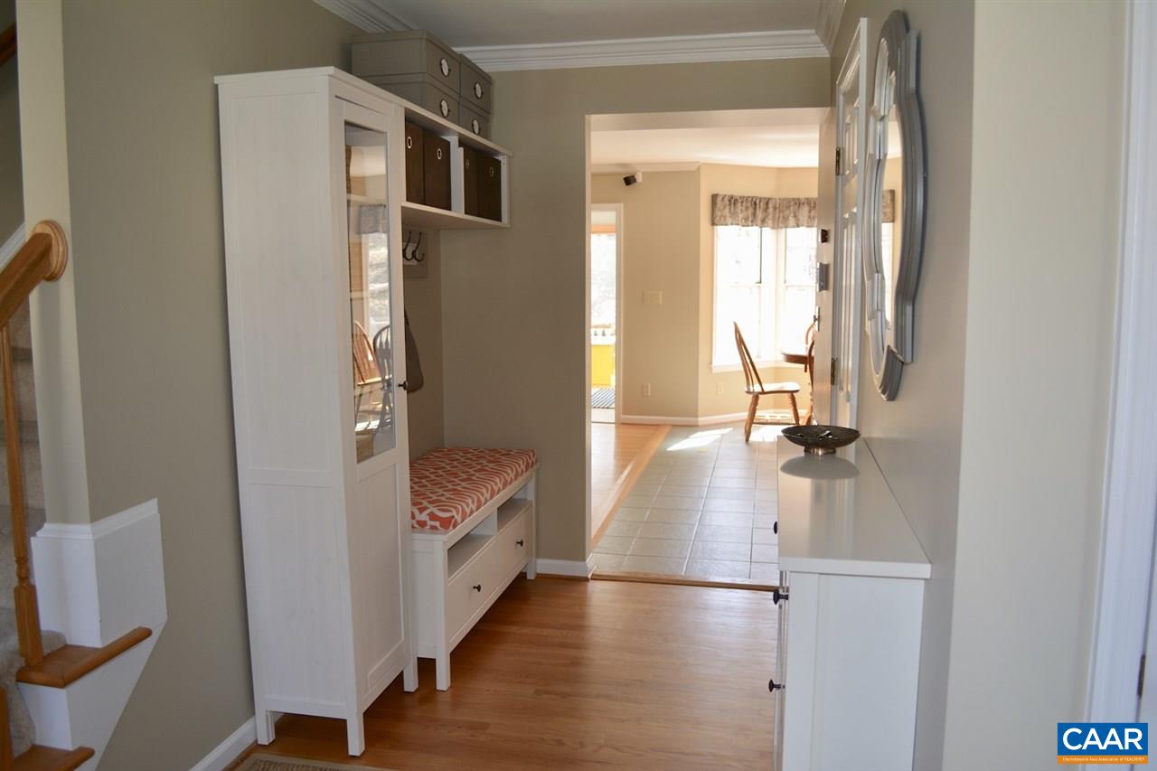 1167 Raintree Drive Charlottesville, VA 22901 - Photo 5 of 24 a view of hallway with walk in closet and wooden floor