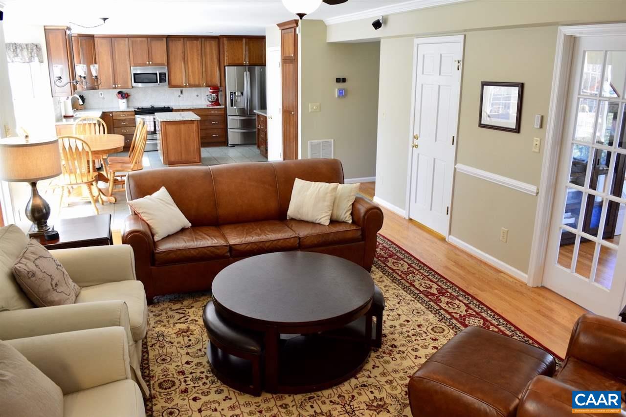 1167 Raintree Drive Charlottesville, VA 22901 - Photo 6 of 24 a living room with furniture a kitchen view and a window