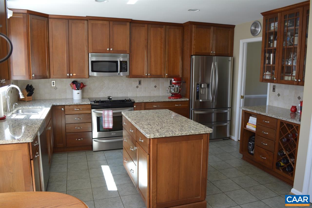 1167 Raintree Drive Charlottesville, VA 22901 - Photo 8 of 24 a kitchen with stainless steel appliances granite countertop a refrigerator stove and sink