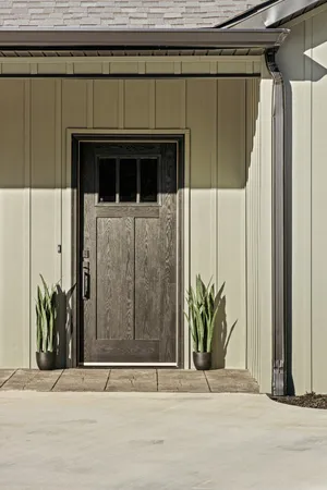 a view of a door and a window