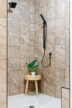 a white bath tub sitting next to a bathroom