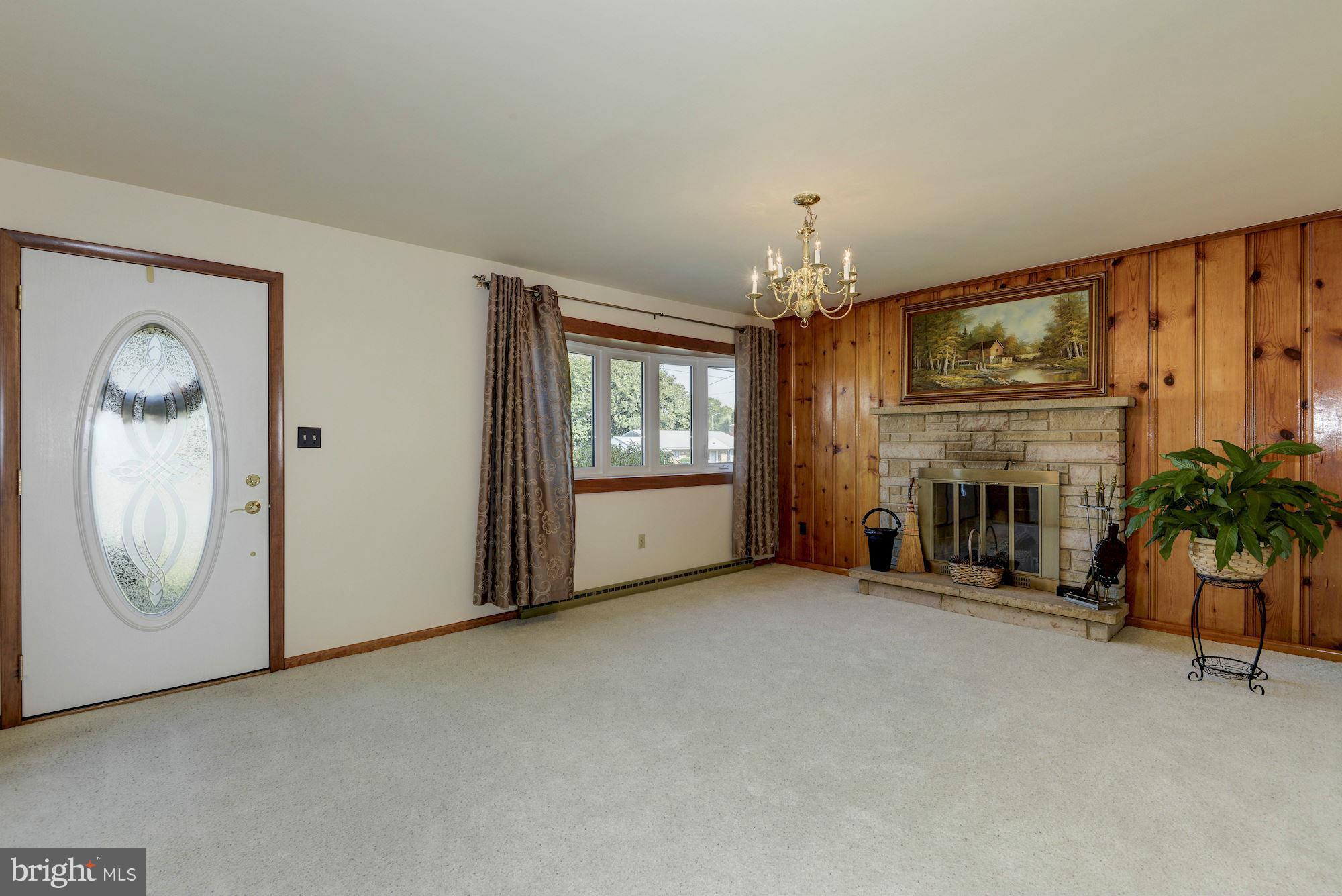 340 Nottingham Road Hagerstown, MD 21740 - Photo 4 of 30 an empty room with windows and fireplace