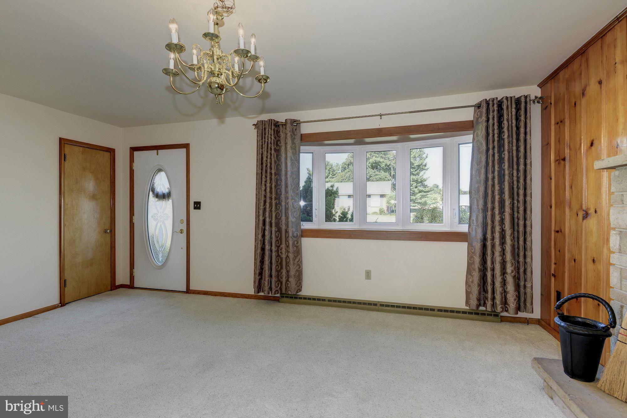 340 Nottingham Road Hagerstown, MD 21740 - Photo 5 of 30 a view of a room that has a large window and chandelier
