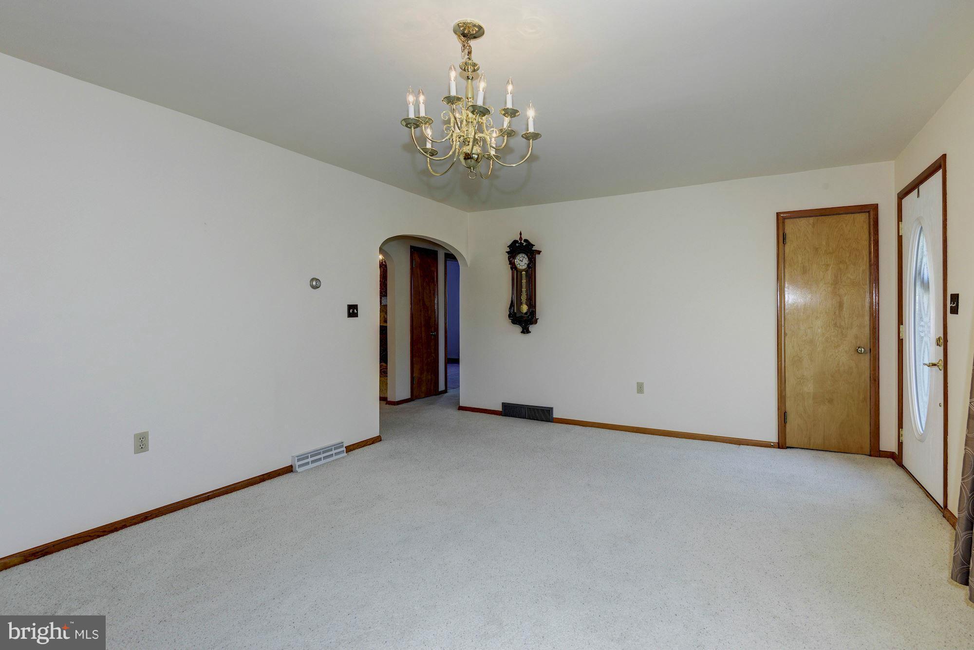 340 Nottingham Road Hagerstown, MD 21740 - Photo 6 of 30 a view of an empty room with chandelier