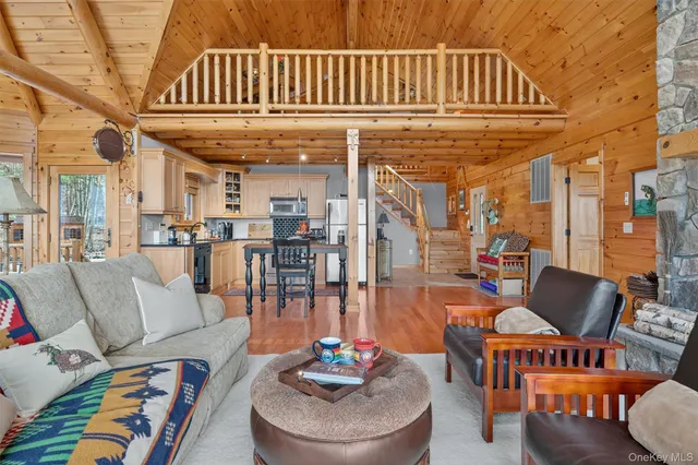 a kitchen with wooden cabinets sink and stainless steel appliances