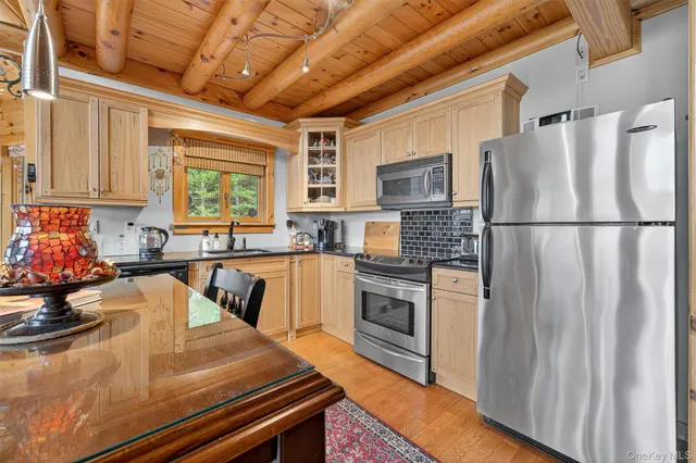 a kitchen with a table chairs stove and cabinets