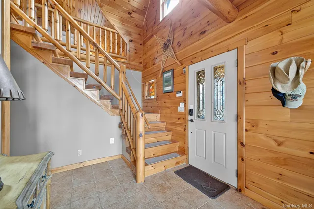 a bed room with a bed and glass walk in closet