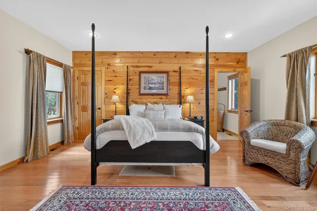 a bed room with a bed window and a dresser