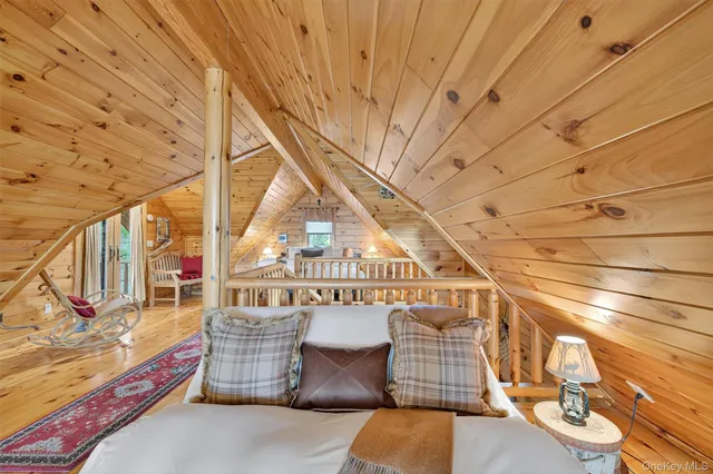 a porch with a bench next to a window